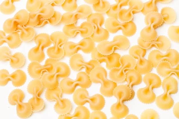 Farfalle pasta on a white background with copy space