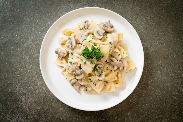 farfalle pasta with mushroom white cream sauce - Italian food style