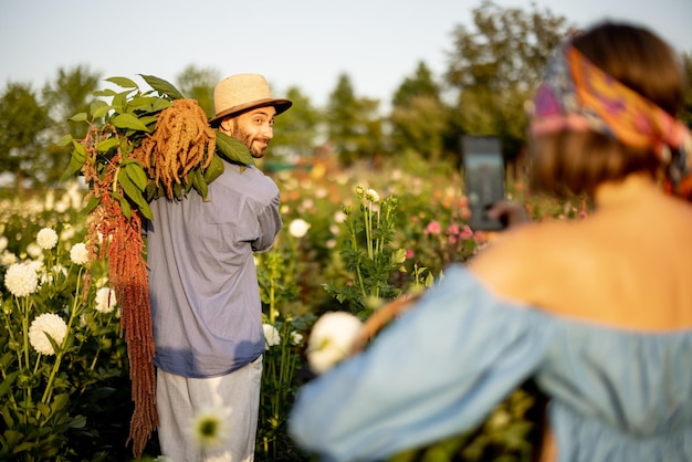 Farm workers have fun on flower farm outdoors