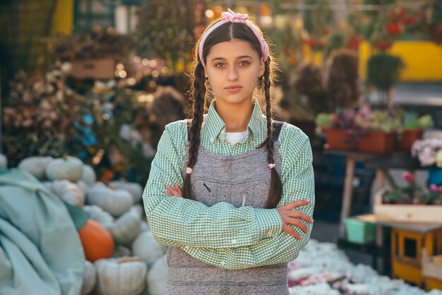 Farmer female poses for the camera in front of the counter