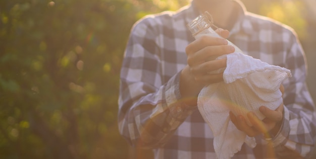 Farmer holding a fresh natural milk in bottles