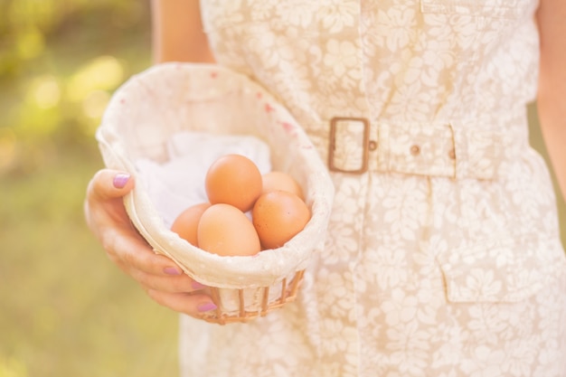 Farmer's hands holding some natural eggss