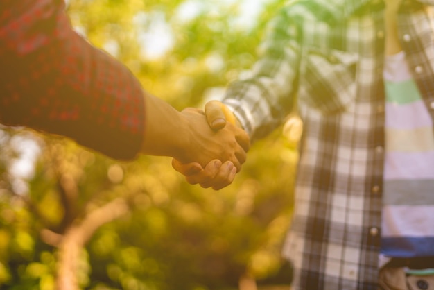 Farmers shake hands sign contract agriculture concepts