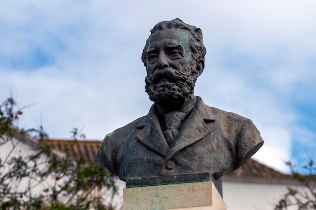 FARO, PORTUGAL: 20th june 2021 - Garden Manuel Bivar bust statue of Joao de Deus poet in Faro city, Portugal.