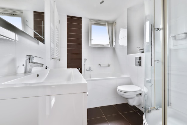 A fascinating bathroom with dark brown tiles and a bathtub