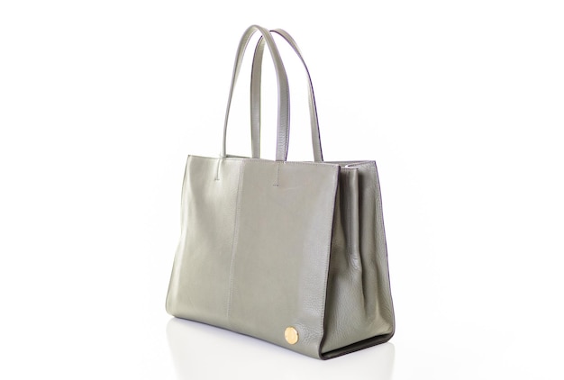 Fashinable womens leather tote bag from gray leather on a white isolated background.