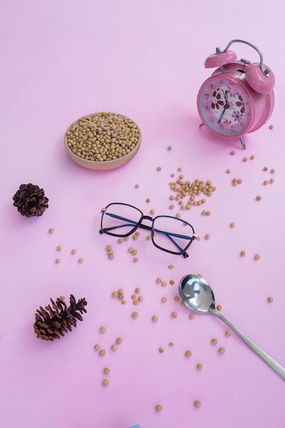 Fashion and beauty concept lying flat with square glasses women's accessories on pink background