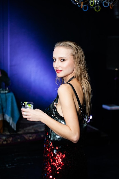 Fashion blonde woman at the party night