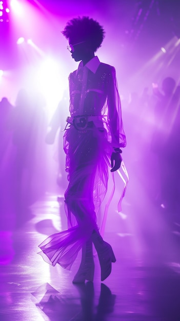 Fashion model in silhouette against vibrant stage lights