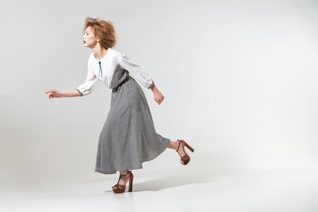 Fashion photo of young posing magnificent woman