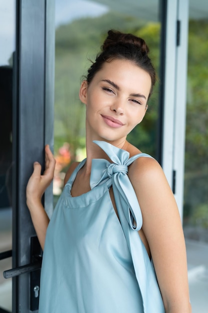 Fashion portrait of beautiful brunette woman posing in stylish evening dress outdoor natural daylight