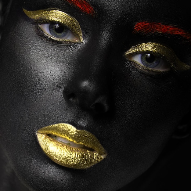 Fashion portrait of a dark-skinned girl with color make-up. Beauty face.