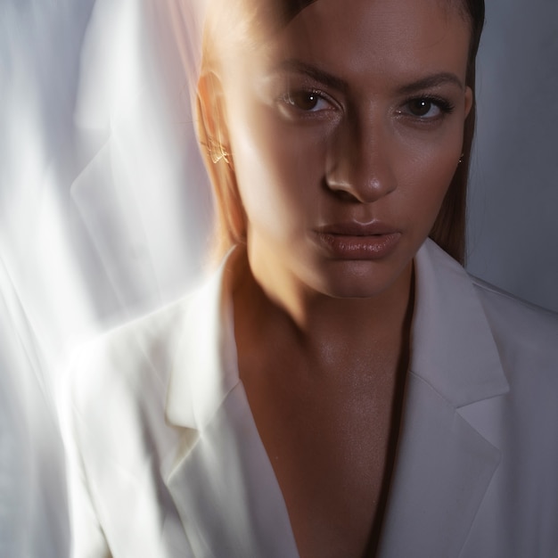 Fashion portrait with the effect of blurring in motion at a long shutter speed