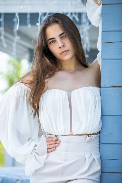 Fashion portrait of a young beautiful brunette girl