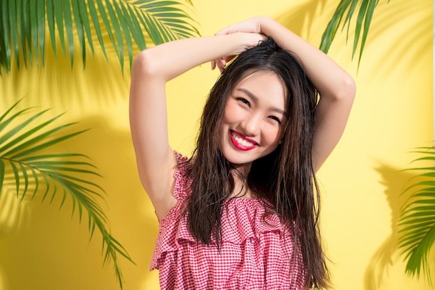 Fashion portrait of a young model with wet long hair. Perfect skin and make-up.