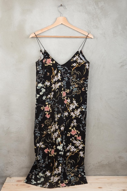 Fashion and shopping concept beautiful dress in floral pattern on a hanger