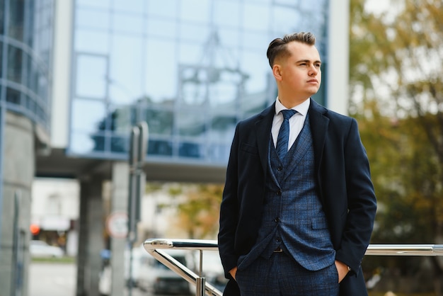 Fashion shot of a handsome young man in elegant classic suit