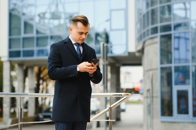 Fashion shot of a handsome young man in elegant classic suit