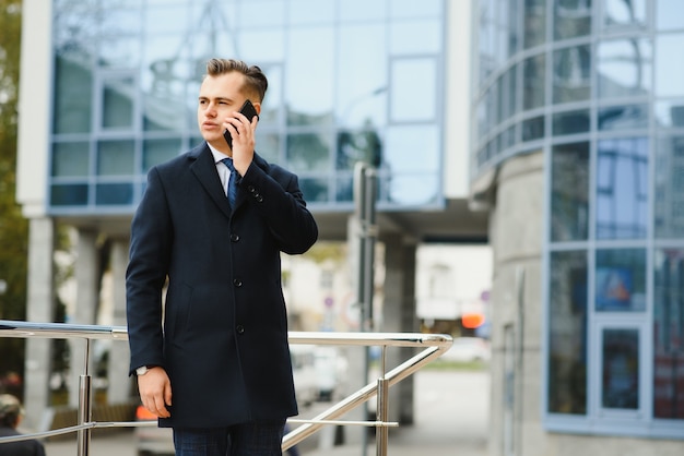 Fashion shot of a handsome young man in elegant classic suit