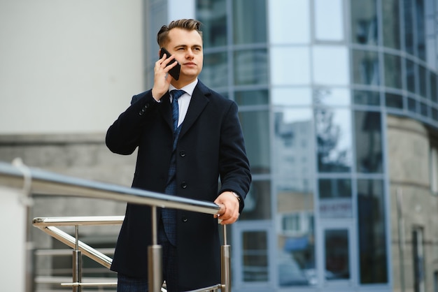 Fashion shot of a handsome young man in elegant classic suit