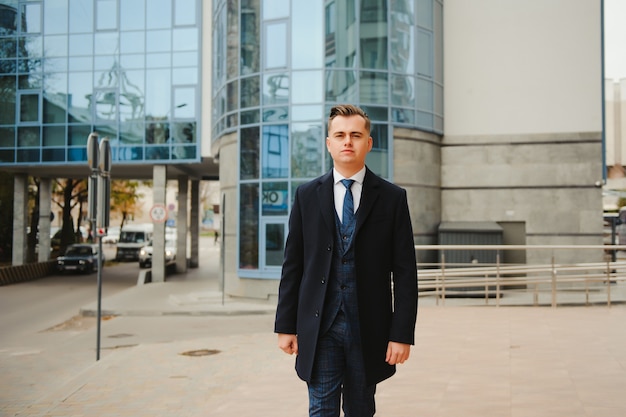 Fashion shot of a handsome young man in elegant classic suit