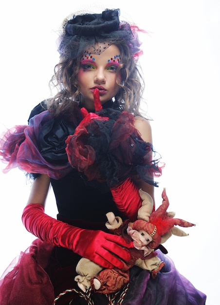 Fashion shot of woman in doll styleCreative makeupFantasy dress