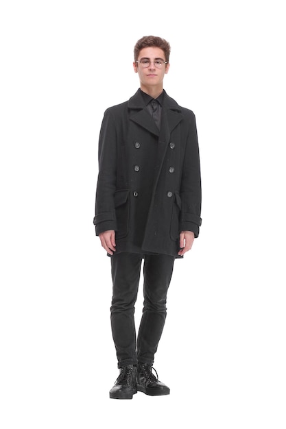 Fashion shot of a young handsome man in black coat. Studio shot isolated over white background