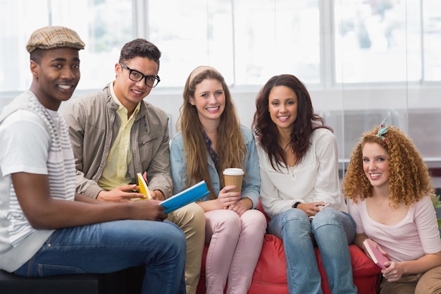 Fashion students smiling at camera together