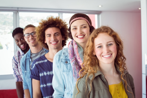 Fashion students smiling in a single line