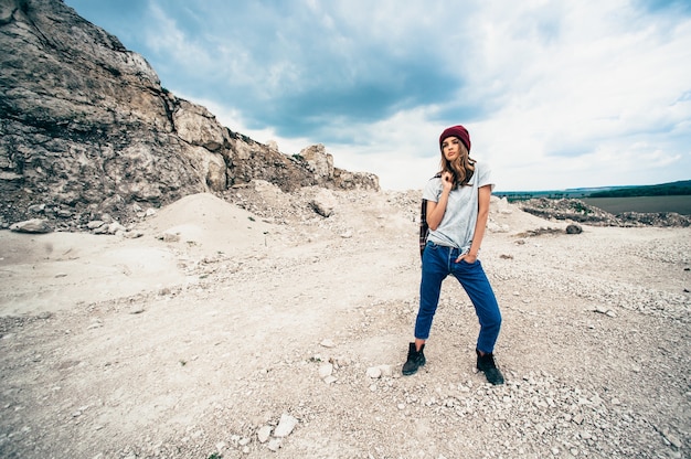 Fashion studio portrait of pretty young hipster blonde woman with bright sexy make up  , wearing stylish urban t shirt and hat, 