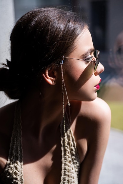 Fashion sunglasses advertising. Sensual woman in glasses. Beautiful female model. Elegant vogue.