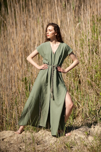 Fashion woman posing in sunny summer day