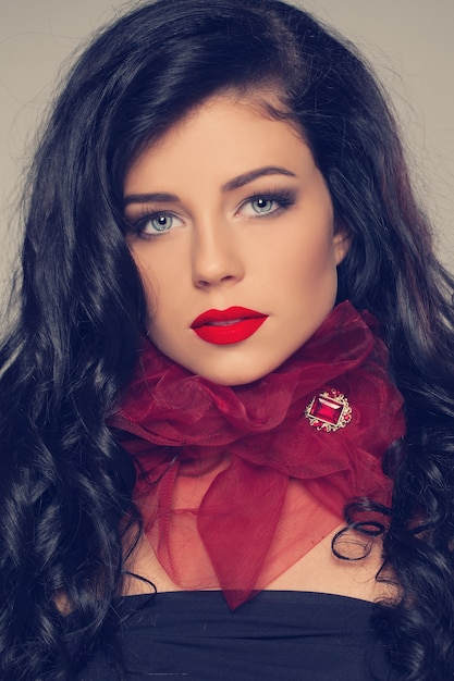 Fashion woman with red brooch