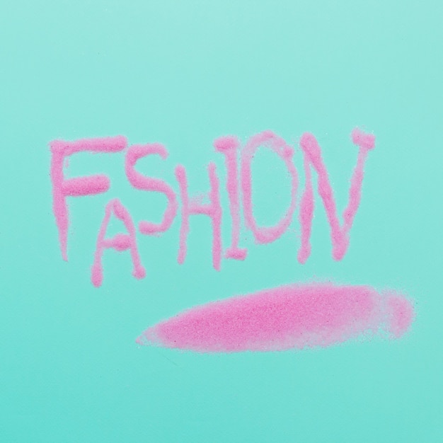 Fashion word by pink sugar on blue background