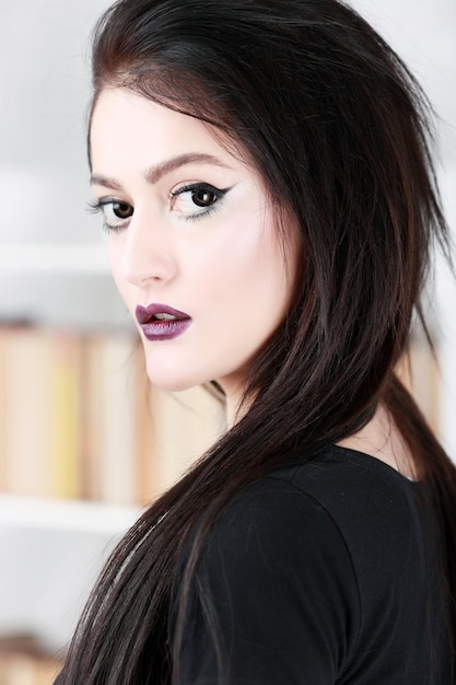 Fashion young woman with dark lips