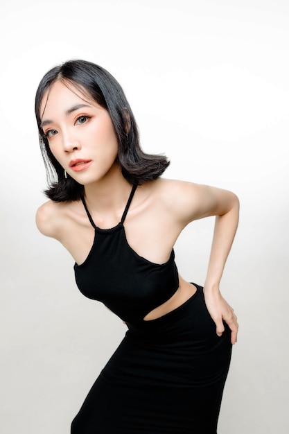 Fashionable asian woman short hair with Perfect body Cute female model with natural makeup and sparkling eyes on white isolated background Facial treatment Cosmetology beauty Concept