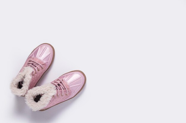 Fashionable children's pink shoes on a white background Top view flat lay