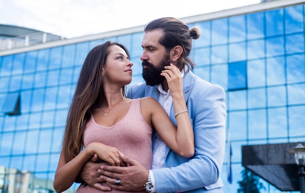 Fashionable loving young couple embracing at city street enjoying relations together love and romance