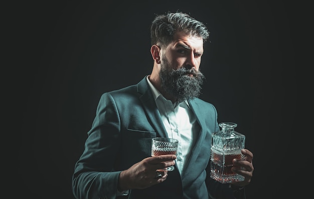 Fashionable man in white shirt and suspenders man drinking alcohol from glass alcohol drink drinking