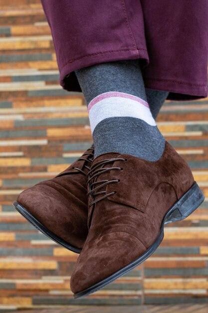 Fashionable men's shoes with beautiful feet in socks