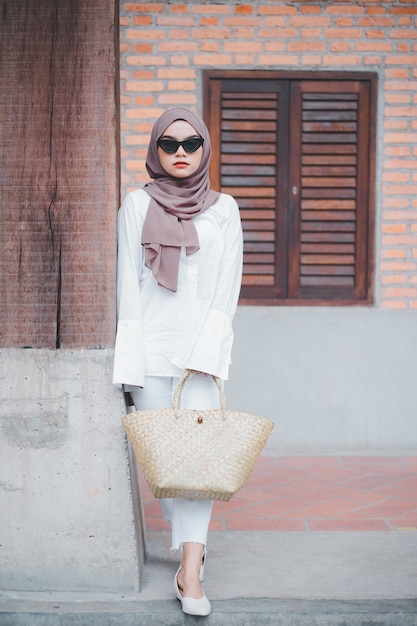 Fashionable Muslim woman wearing hijab and sunglasses