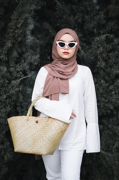 Fashionable Muslim woman wearing hijab and sunglasses