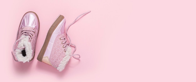 Fashionable shoes for a girl on a pink background. Top view, flat lay. Banner.