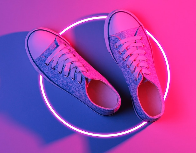 Fashionable sneakers. 80s synth wave and retrowave glowing circle futuristic aesthetics