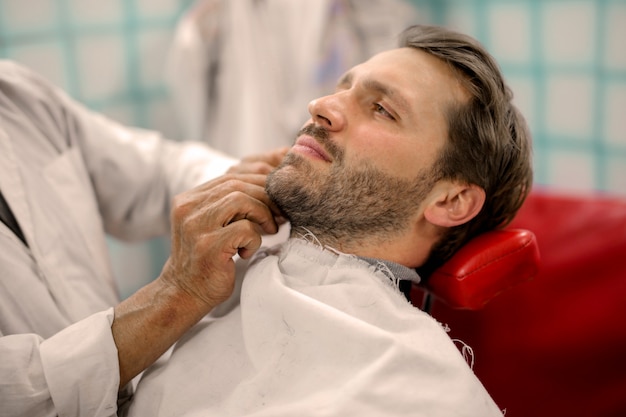 Fashionable stylish man at the barber