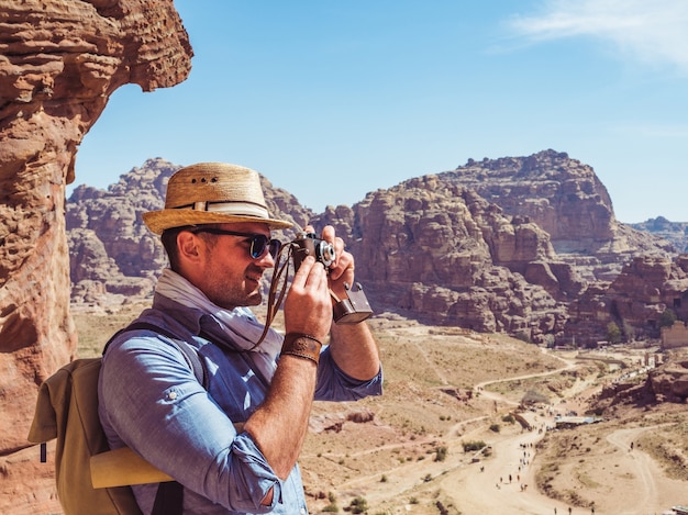 Fashionable tourist with a vintage camera