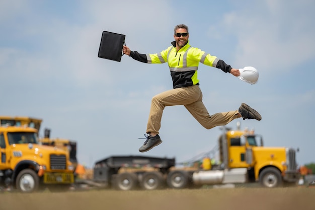 Fast building funny construction worker jumping excited jump of builders run in helmet worker in