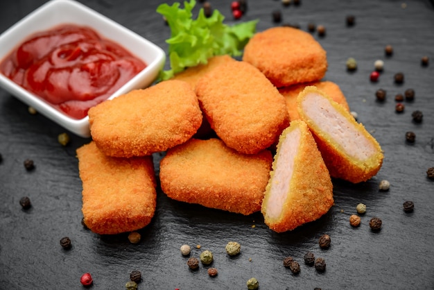 Fast food chicken nuggets with ketchup