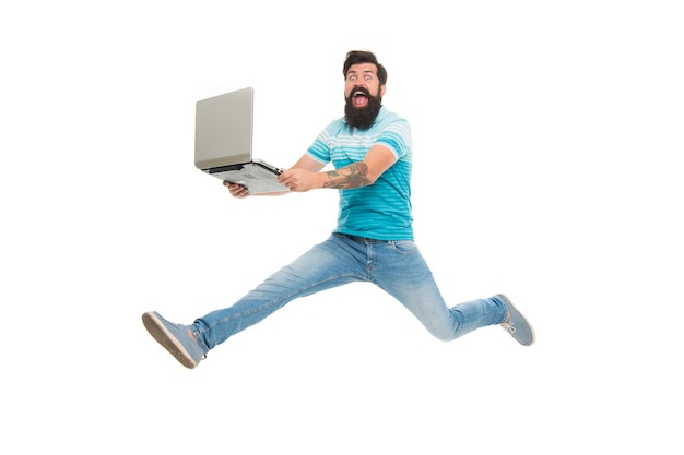 Fast internet. Technologies running world. Man run with modern laptop captured in motion. Never stop. Hipster surprised bearded web developer designer or programmer with laptop. Modern laptop concept.