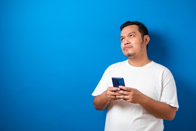 Fat Asian guy wearing a white T-shirt isolated